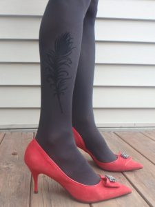dark grey pantyhose with a feather pattern on the side and red suede shoes 